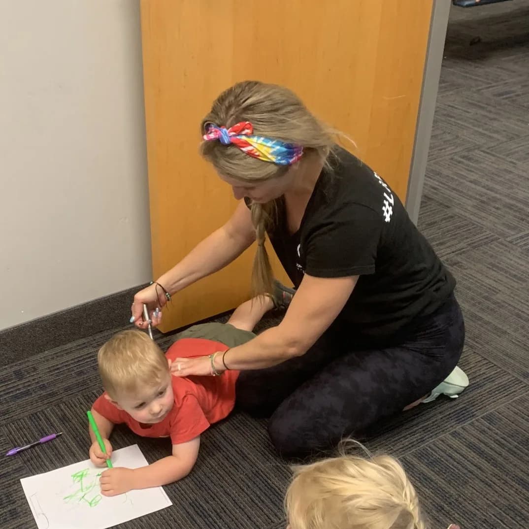 A parent stays with a child during a pediatric visit at Complete Rehab QC.